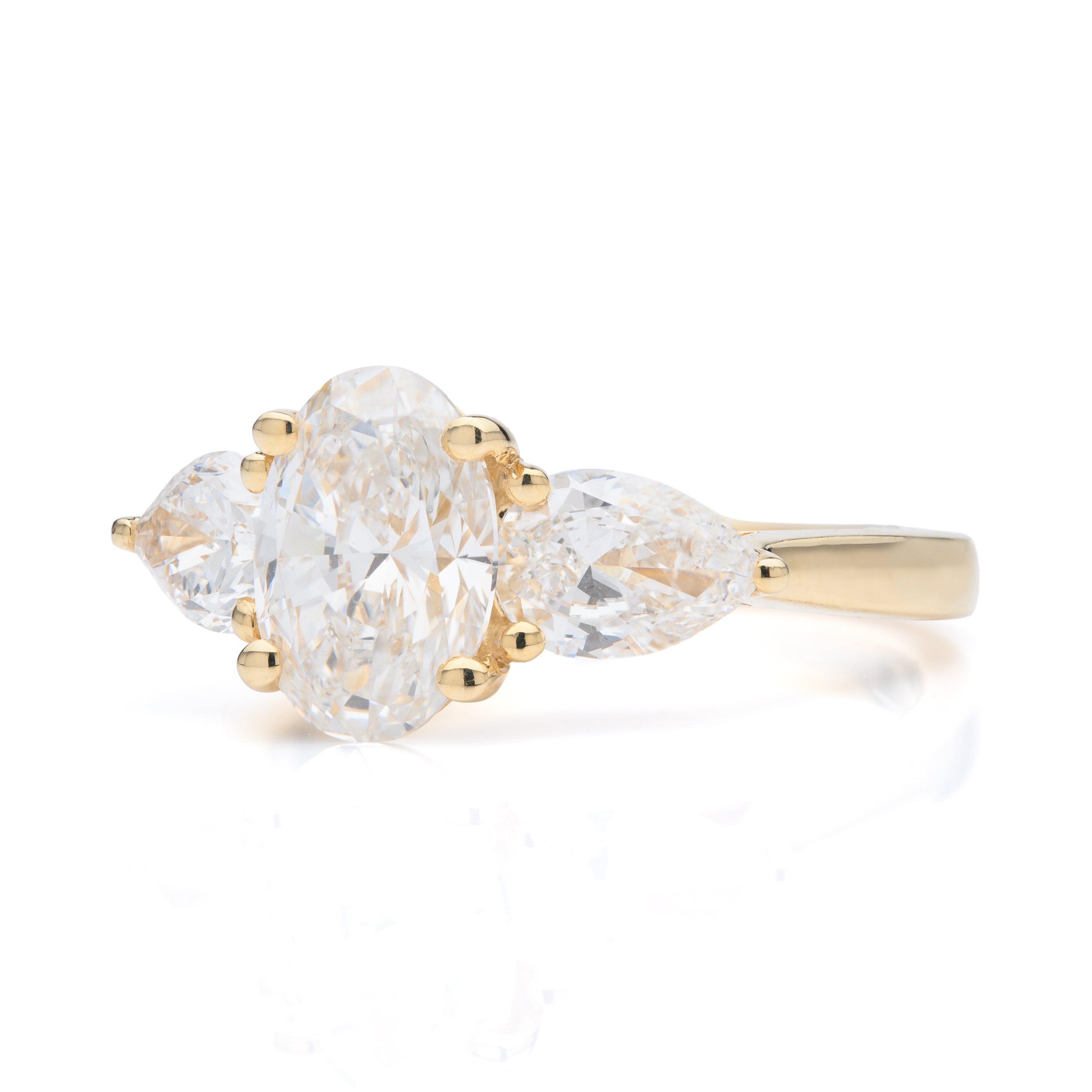 18ct Yellow Gold Oval Cut Lab Grown Diamond and Pear Cut Shoulder Lab Grown Diamond Trilogy Ring
