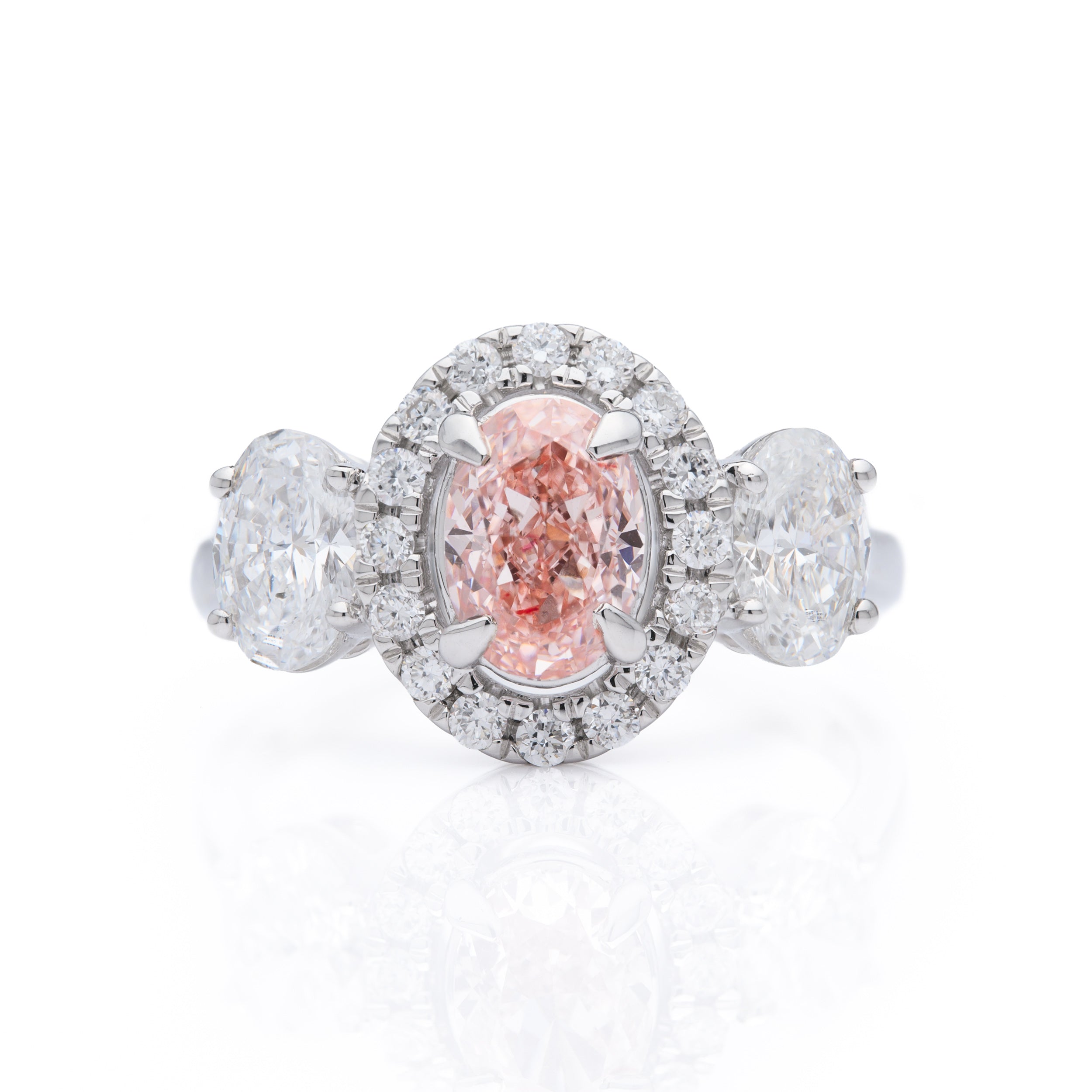 18ct White Gold Oval Cut Pink Lab Grown Diamond ring with a Brilliant Cut Lab Grown Diamond Halo cluster and Oval Cut Lab Grown Diamond Shoulders.