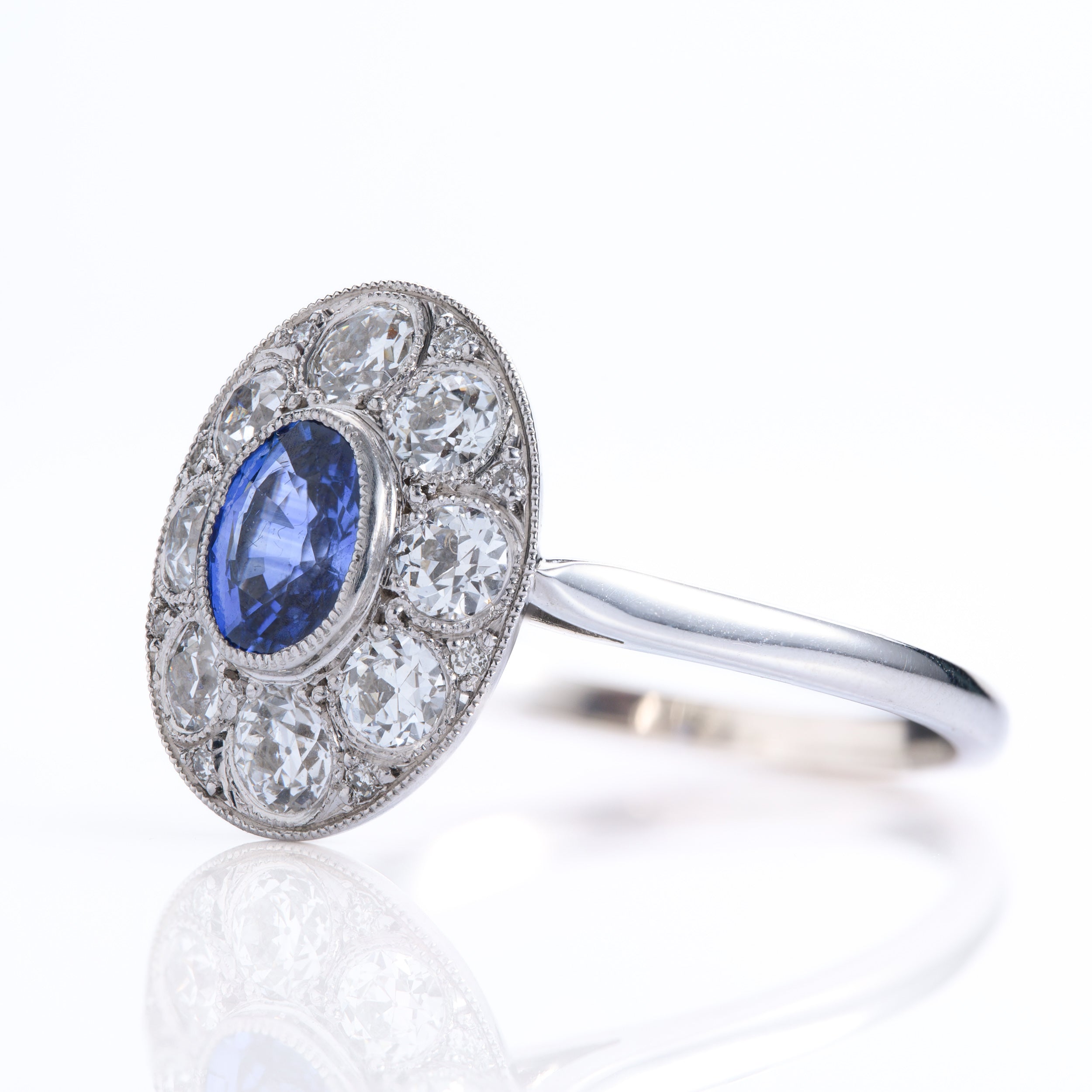 Pre-Owned 18ct White Gold Oval Cut Sapphire & Round Brilliant Cut Diamond Cluster Ring