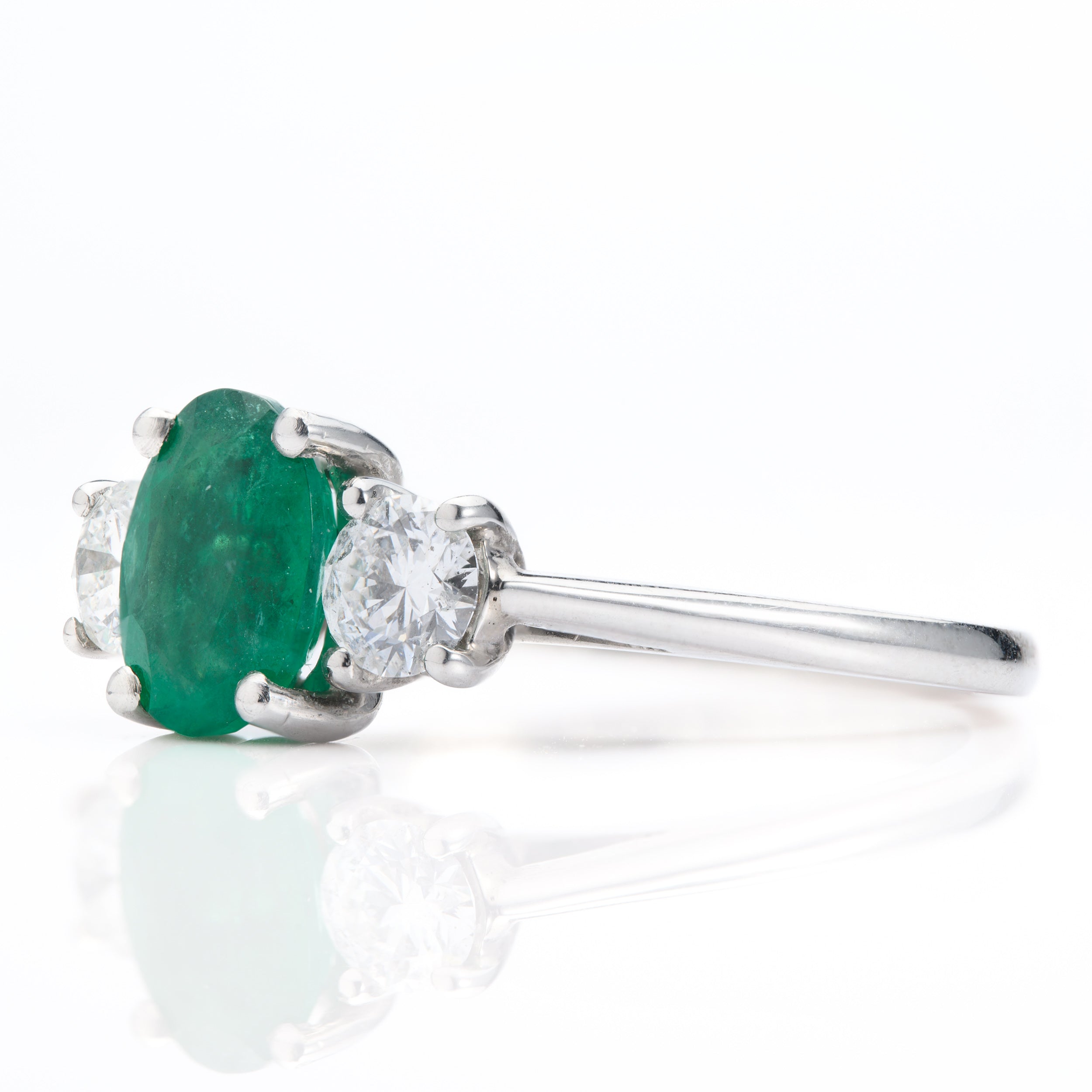 Platinum Oval Cut Emerald & Round Brilliant Cut Diamond Trilogy Ring