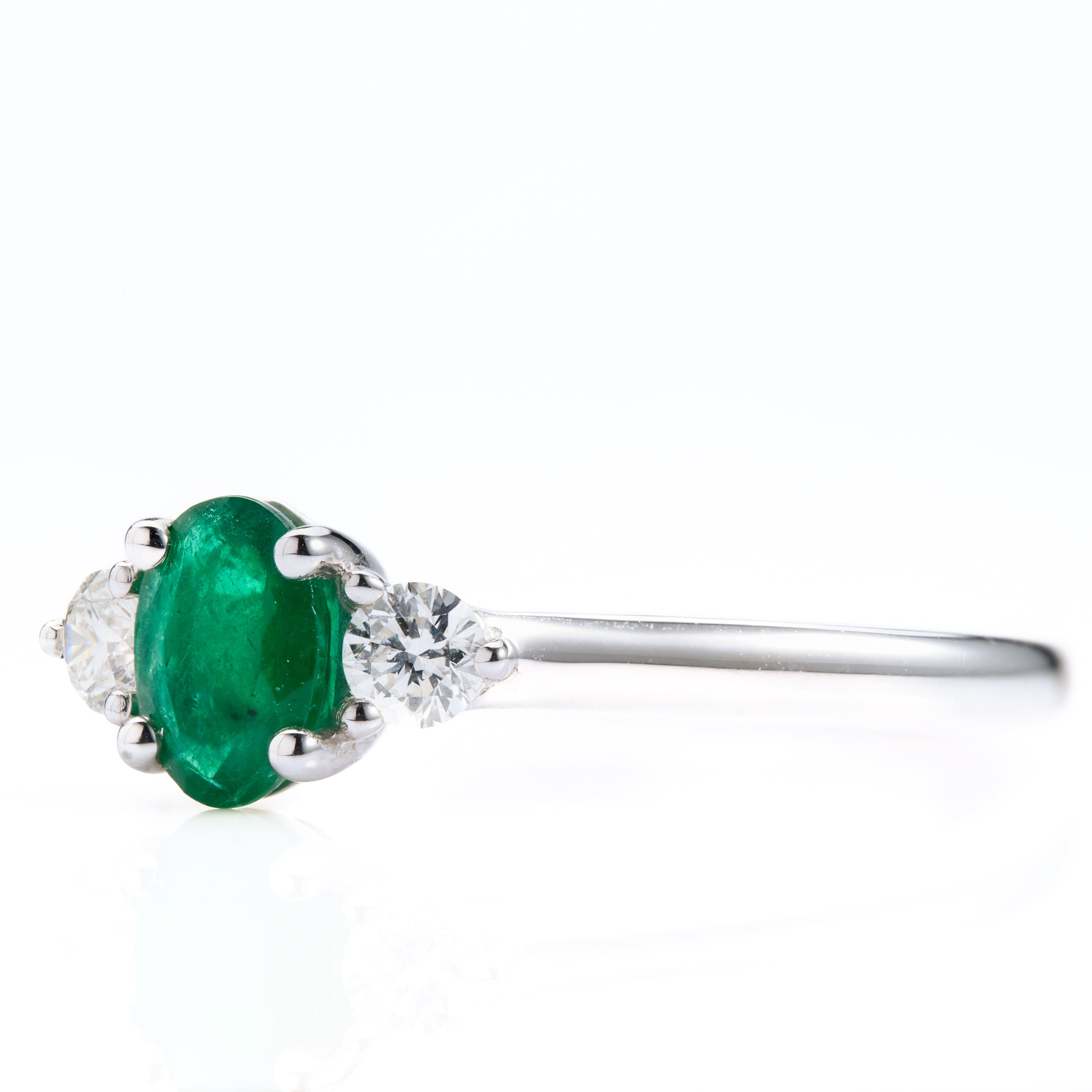 Platinum Oval Cut Emerald & Round Brilliant Cut Diamond Trilogy Ring