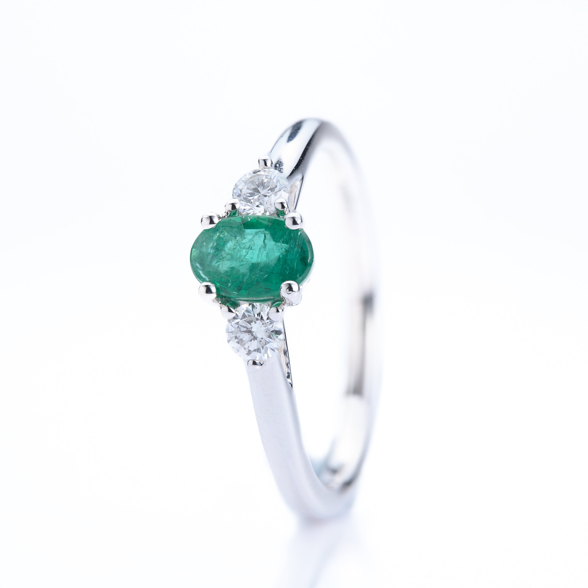 Platinum Oval Cut Emerald & Round Brilliant Cut Diamond Trilogy Ring