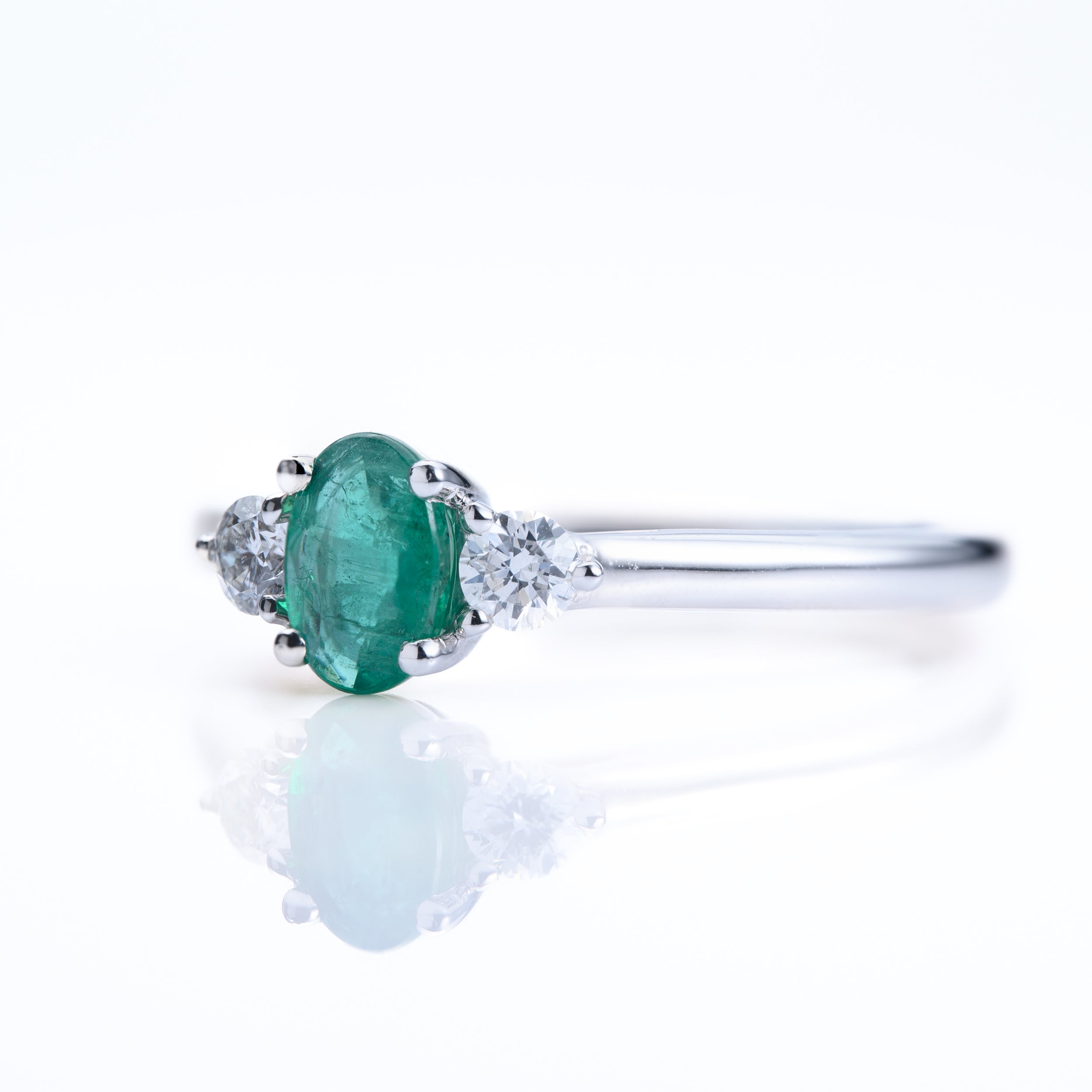 Platinum Oval Cut Emerald & Round Brilliant Cut Diamond Trilogy Ring