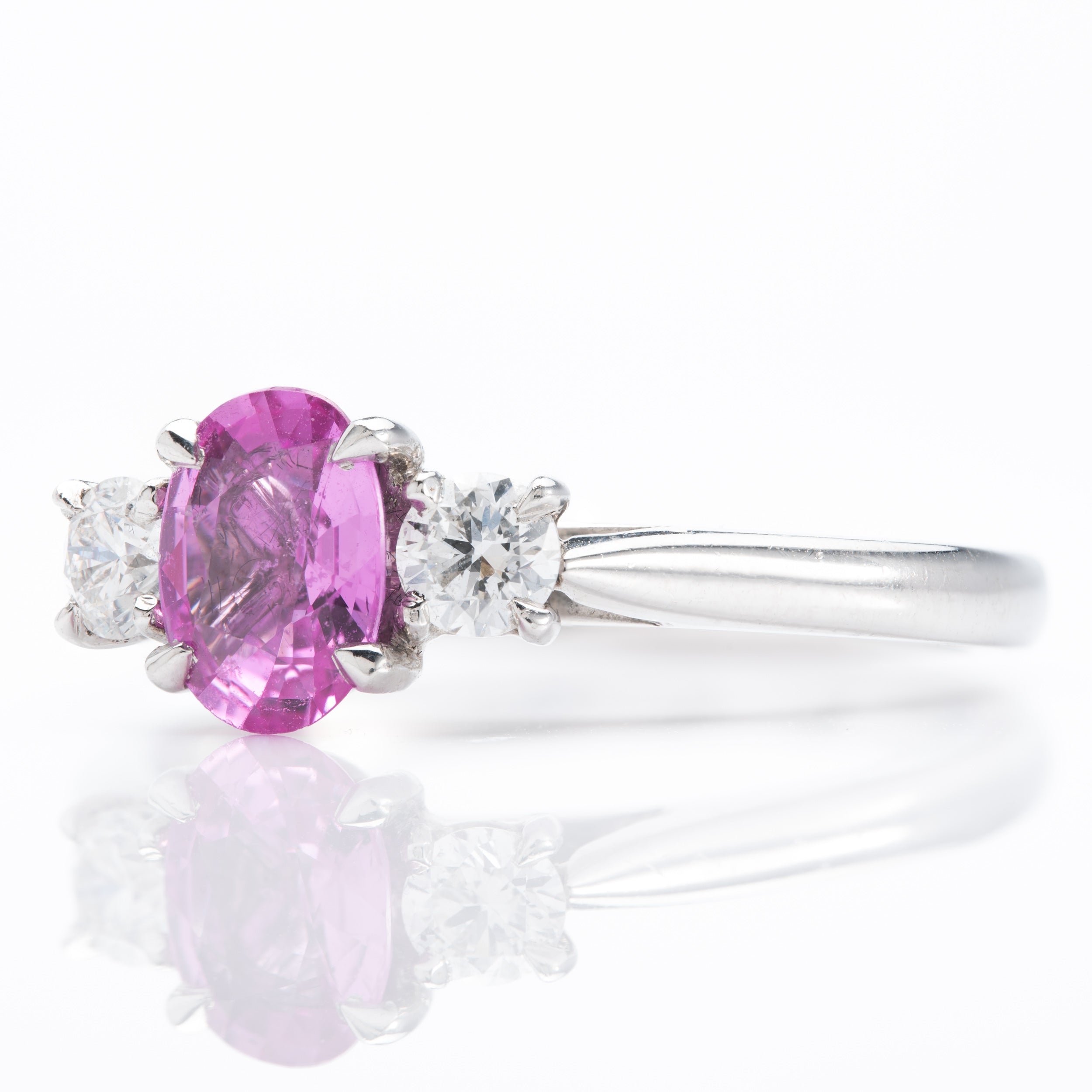 Platinum Oval Cut Pink Sapphire & Round Brilliant Cut Diamond Trilogy Ring