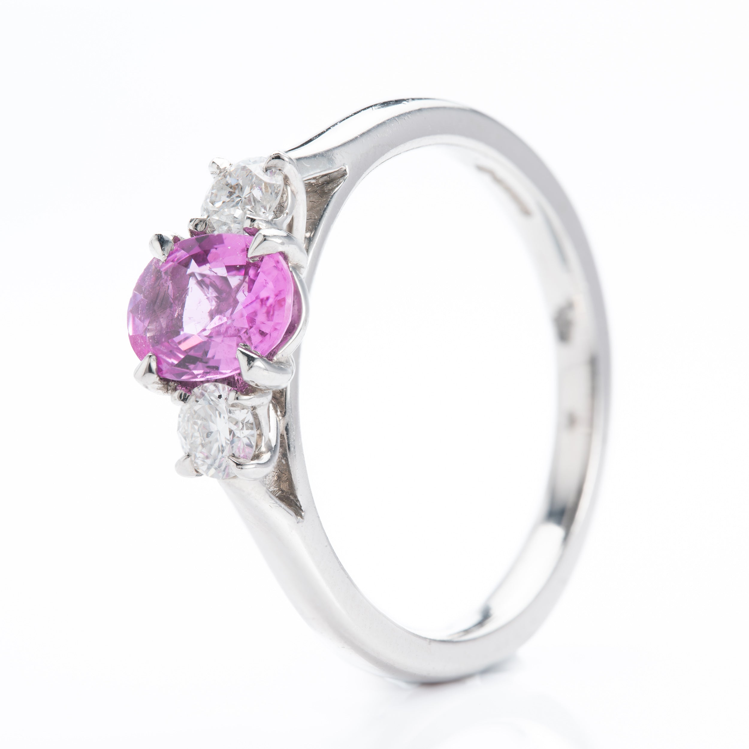 Platinum Oval Cut Pink Sapphire & Round Brilliant Cut Diamond Trilogy Ring