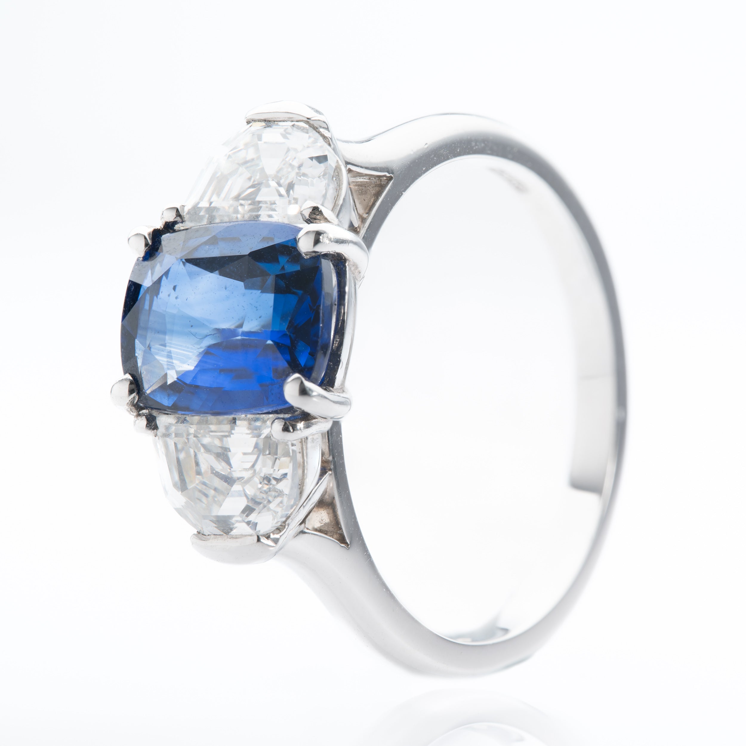 Platinum Cushion Cut Sapphire and Trapeze Cut Diamond Trilogy Ring
