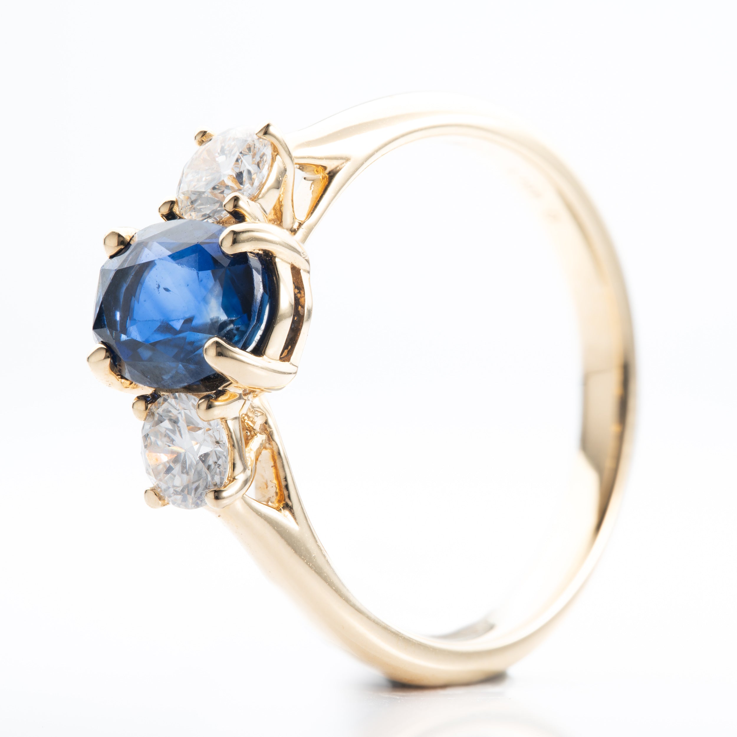 18ct Yellow Gold Oval Cut Sapphire and Brilliant Cut Diamond Trilogy Ring