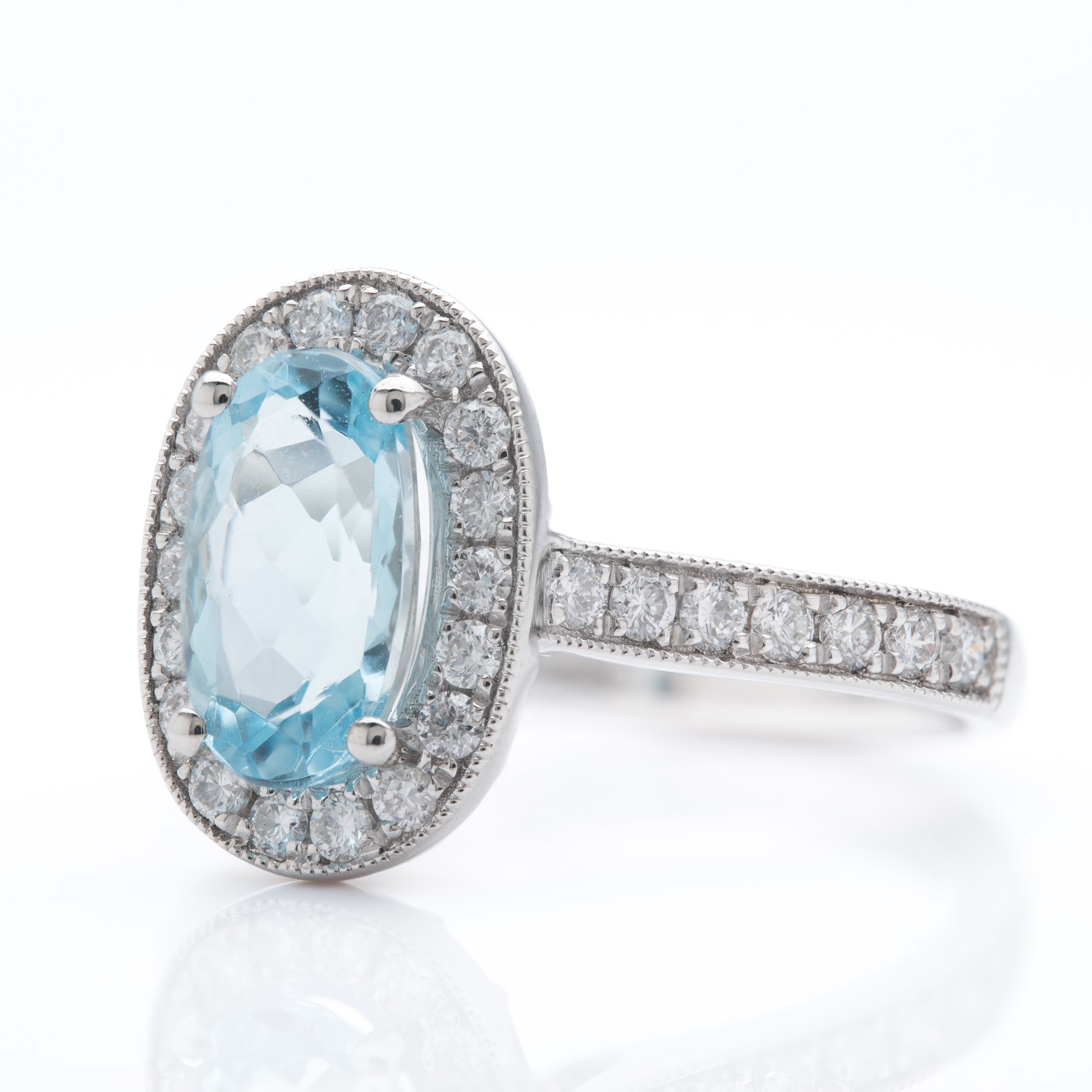 Platinum Oval Cut Aquamarine and Brilliant Round Cut Diamond Cluster Ring