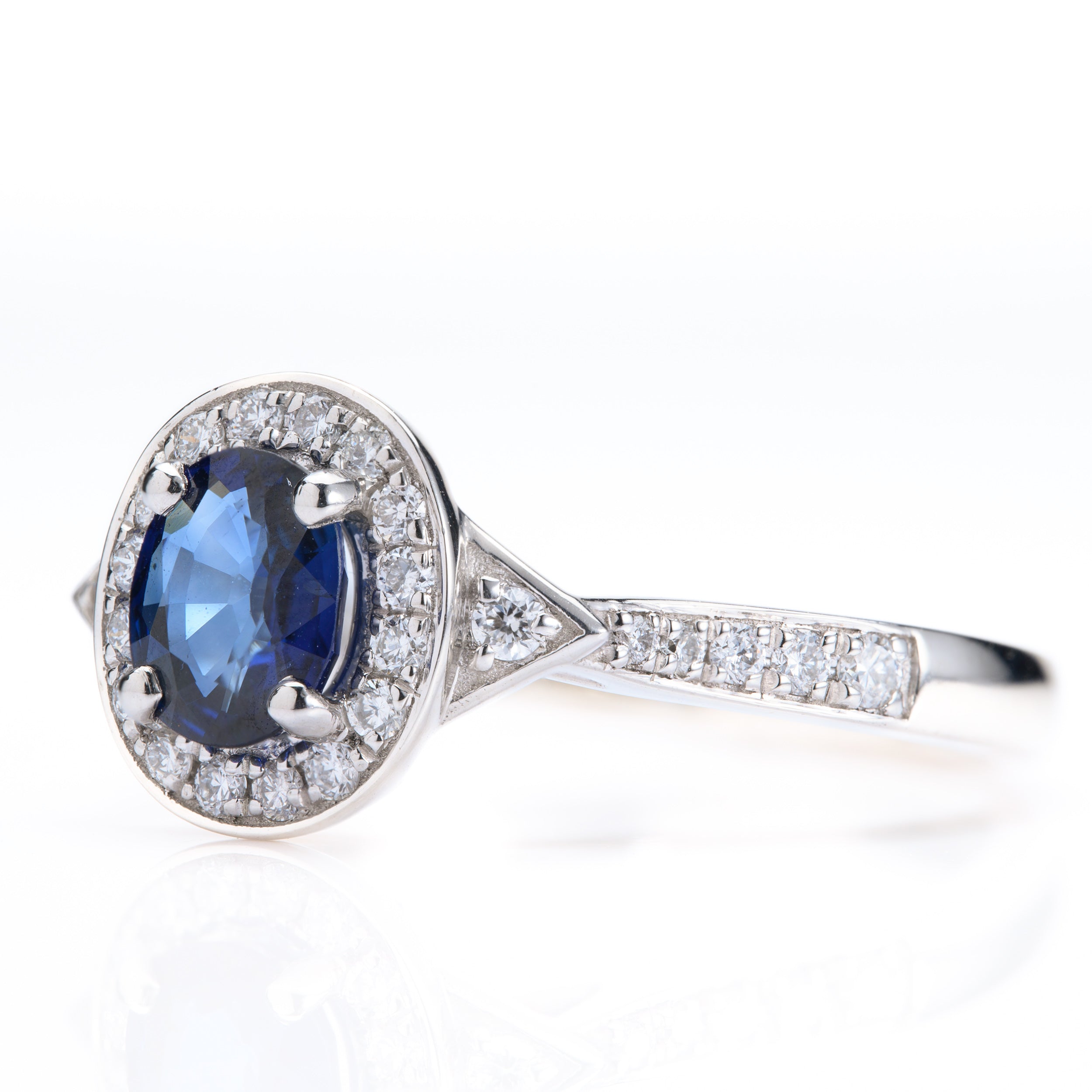 Platinum Oval Cut Sapphire & Round Brilliant Cut Diamond Halo Cluster Ring