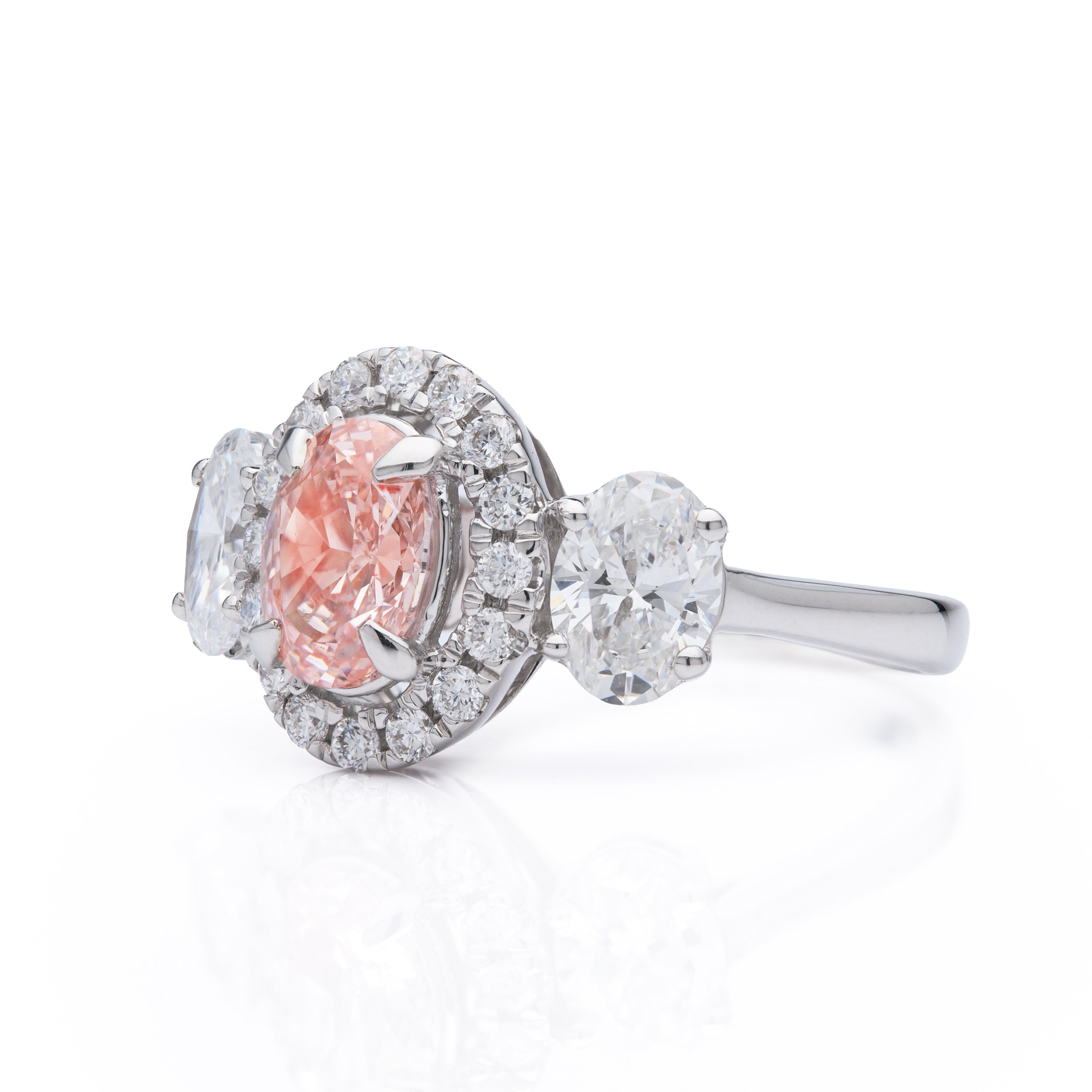 18ct White Gold Oval Cut Pink Lab Grown Diamond ring with a Brilliant Cut Lab Grown Diamond Halo cluster and Oval Cut Lab Grown Diamond Shoulders.