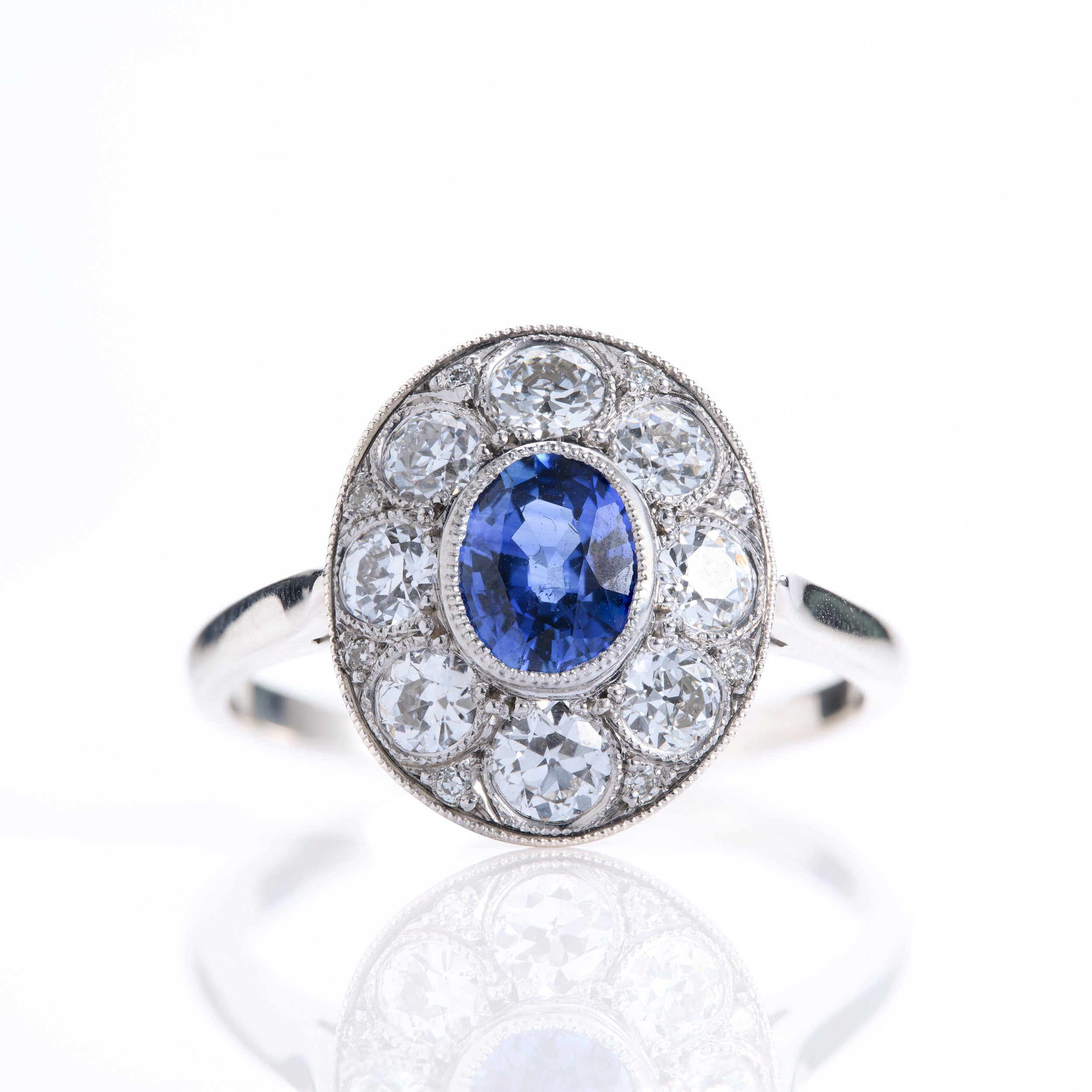 Pre-Owned 18ct White Gold Oval Cut Sapphire & Round Brilliant Cut Diamond Cluster Ring