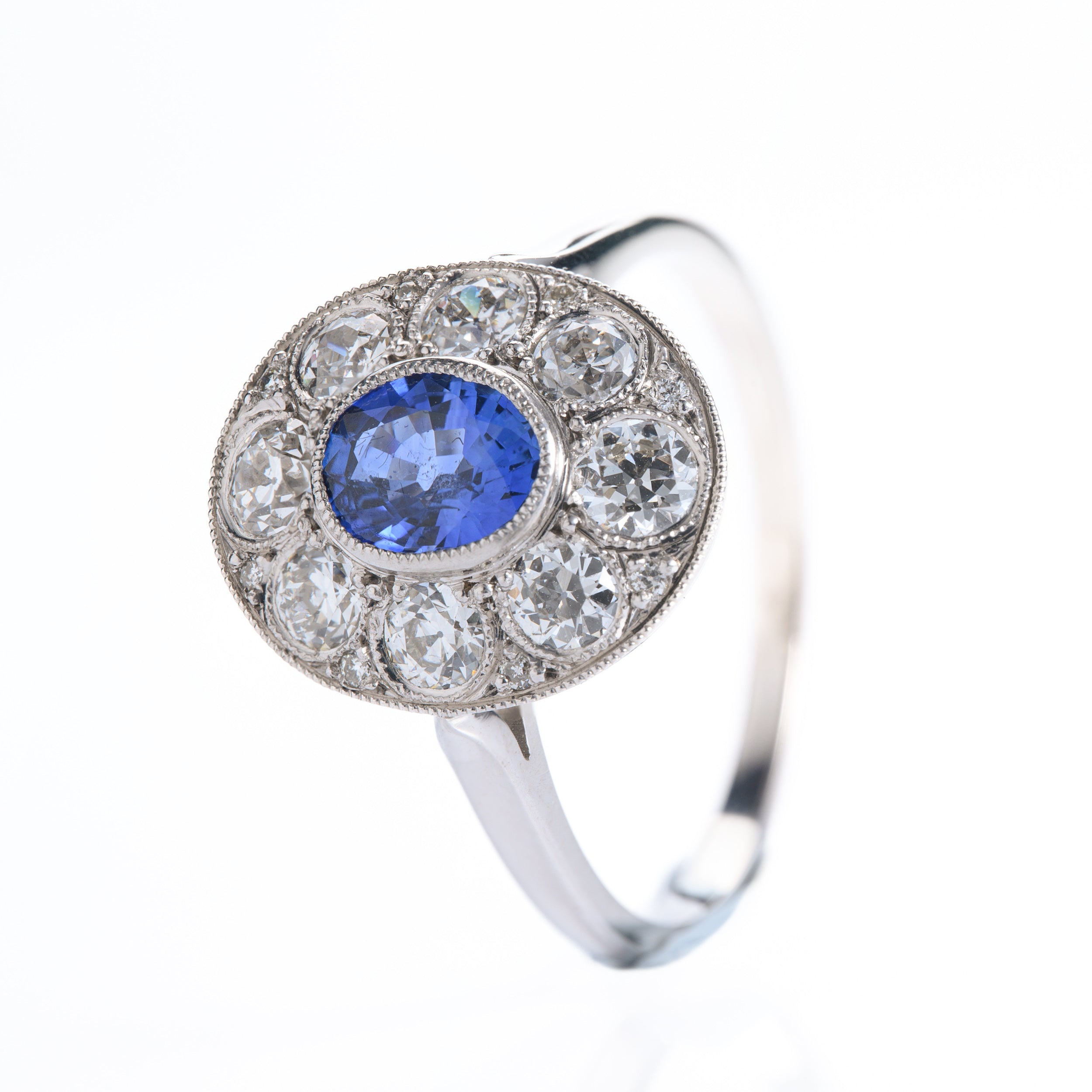 Pre-Owned 18ct White Gold Oval Cut Sapphire & Round Brilliant Cut Diamond Cluster Ring