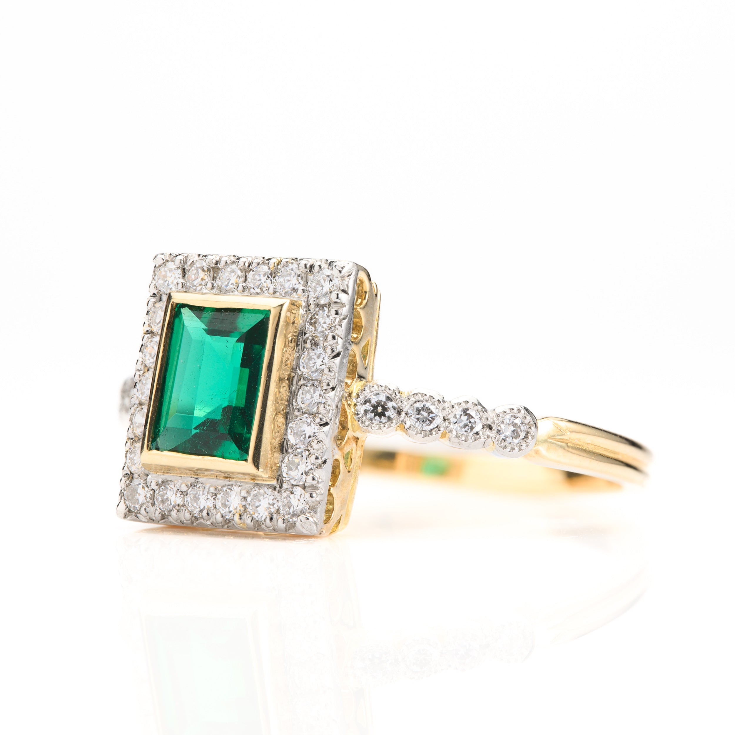 18ct Yellow Gold & Platinum Rectangular Cut Emerald & Round Brilliant Cut Diamond Halo Cluster Ring