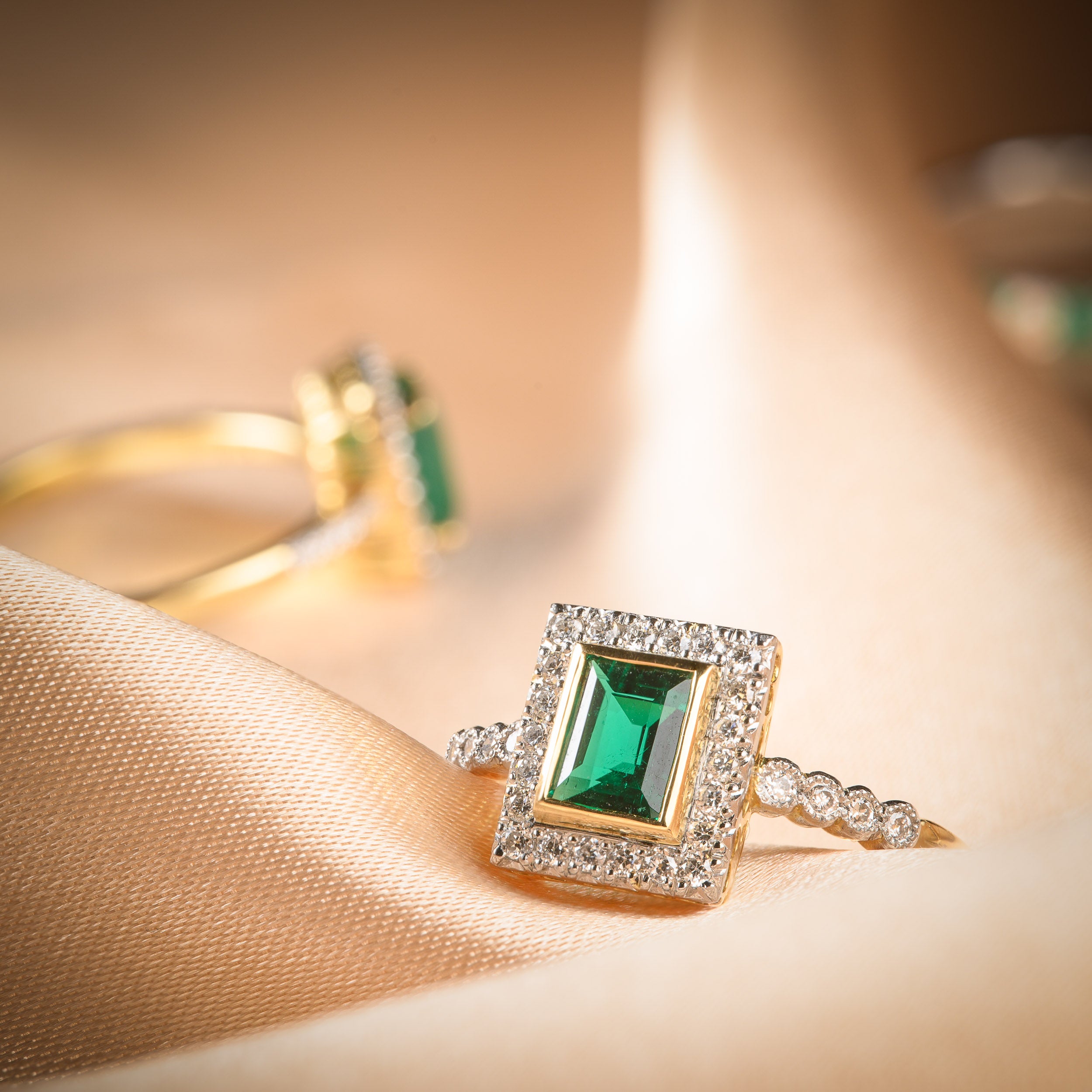 Emerald Rings on Gold Fabric