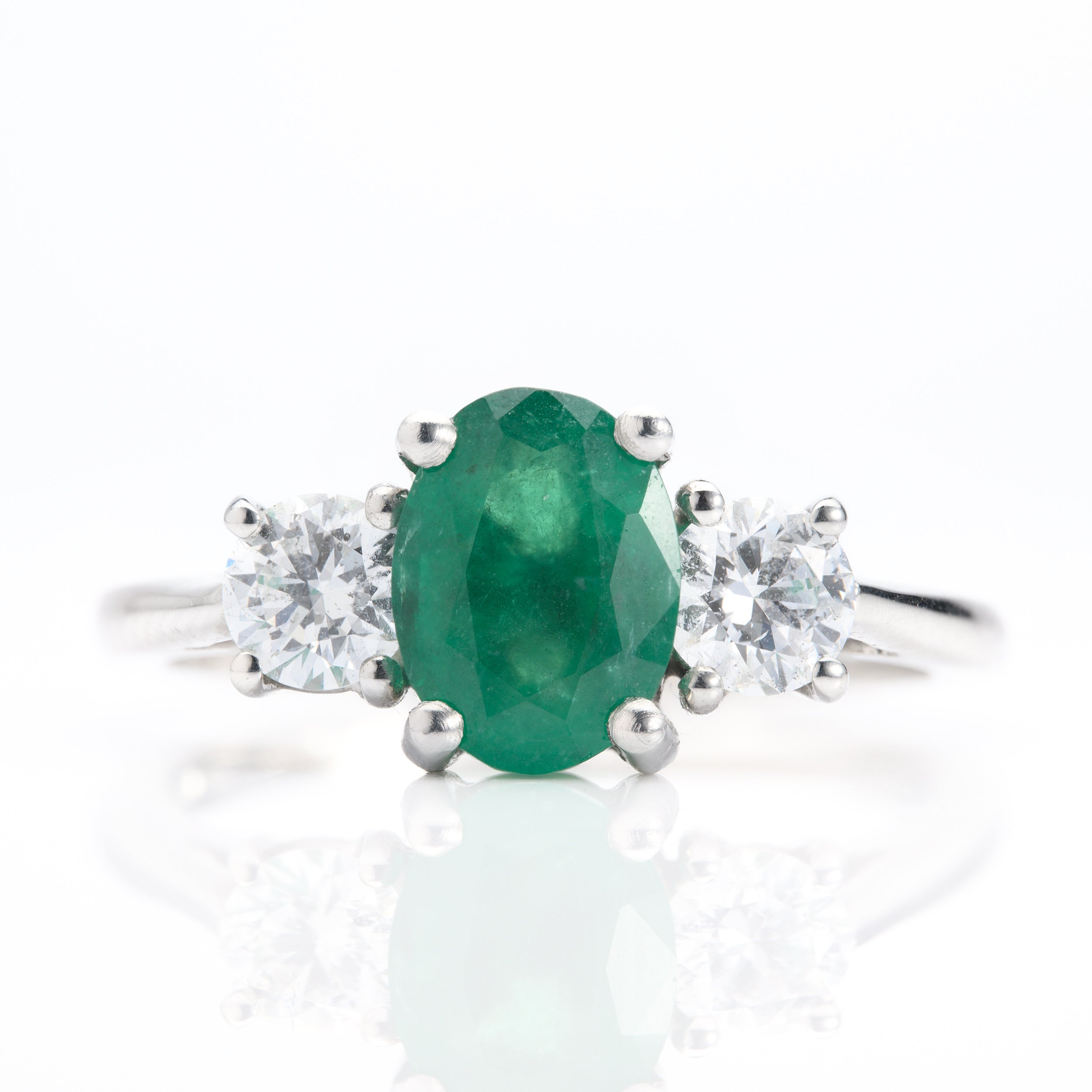 Platinum Oval Cut Emerald & Round Brilliant Cut Diamond Trilogy Ring