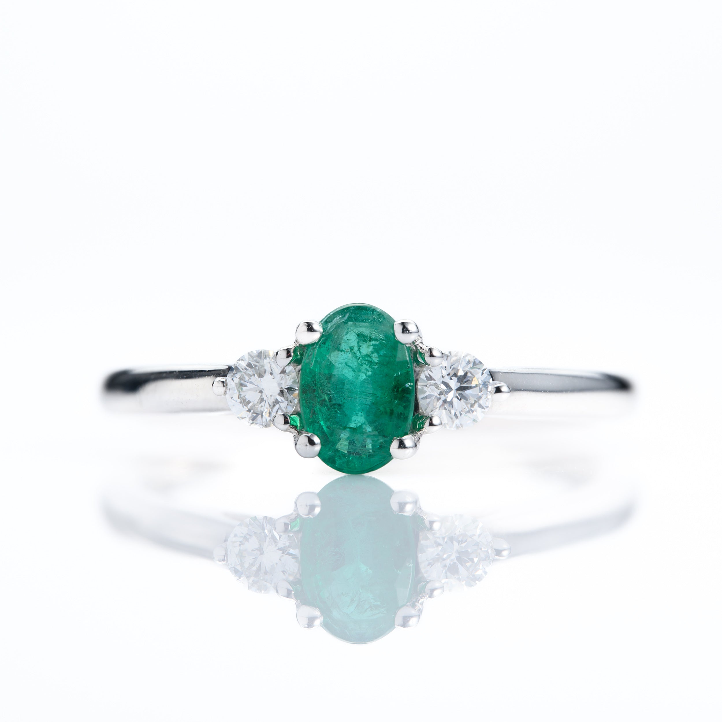 Platinum Oval Cut Emerald & Round Brilliant Cut Diamond Trilogy Ring