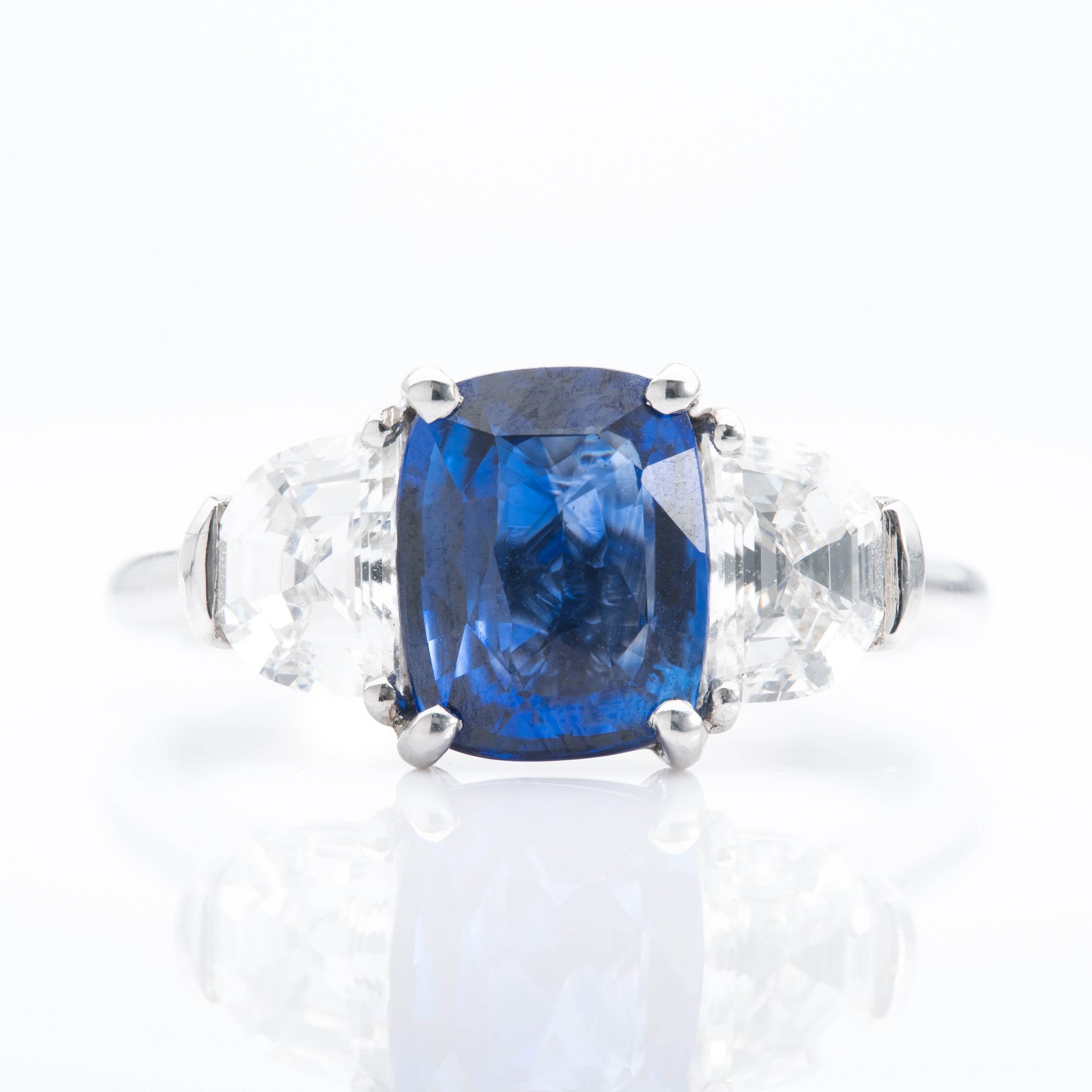 Platinum Cushion Cut Sapphire and Trapeze Cut Diamond Trilogy Ring