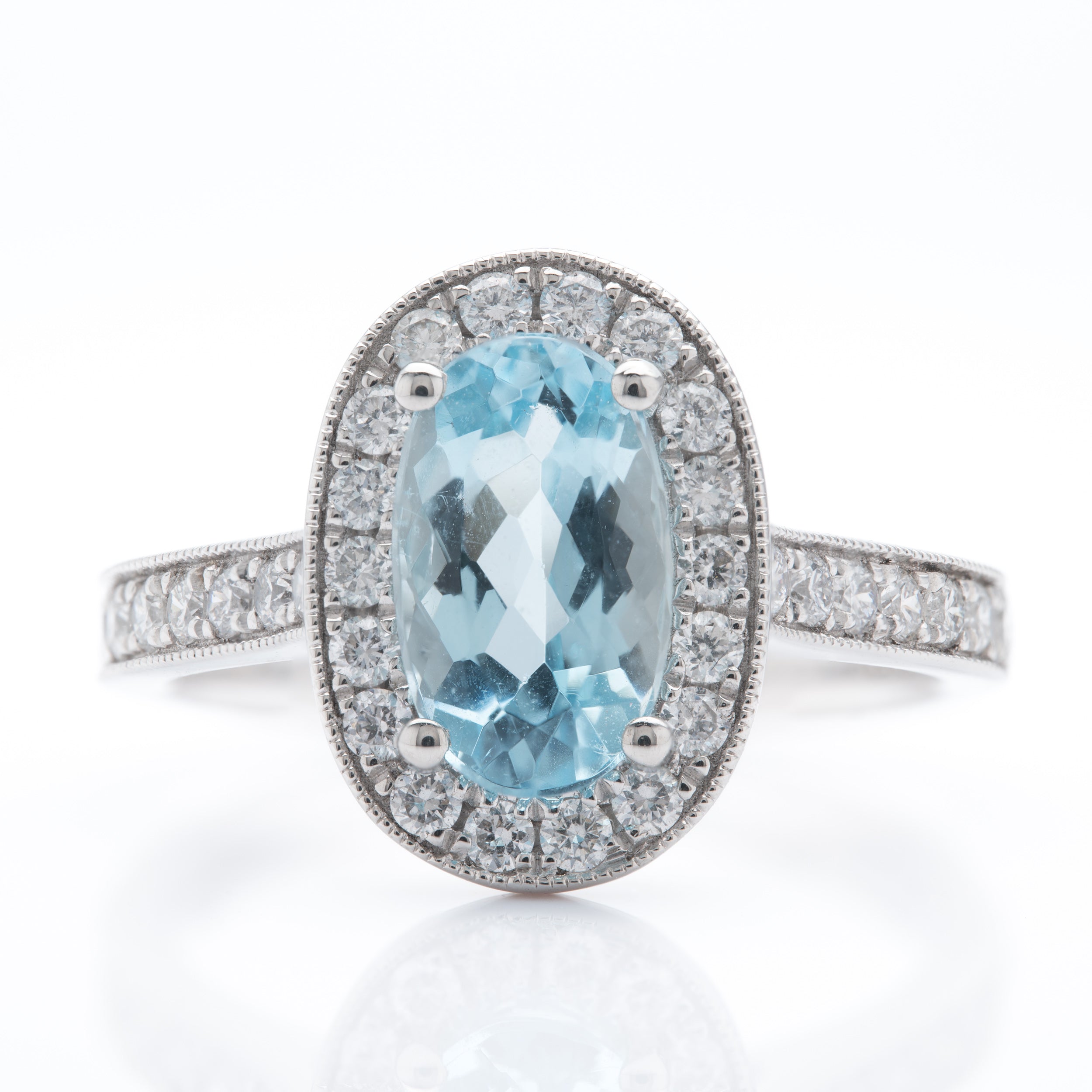 Platinum Oval Cut Aquamarine and Brilliant Round Cut Diamond Cluster Ring