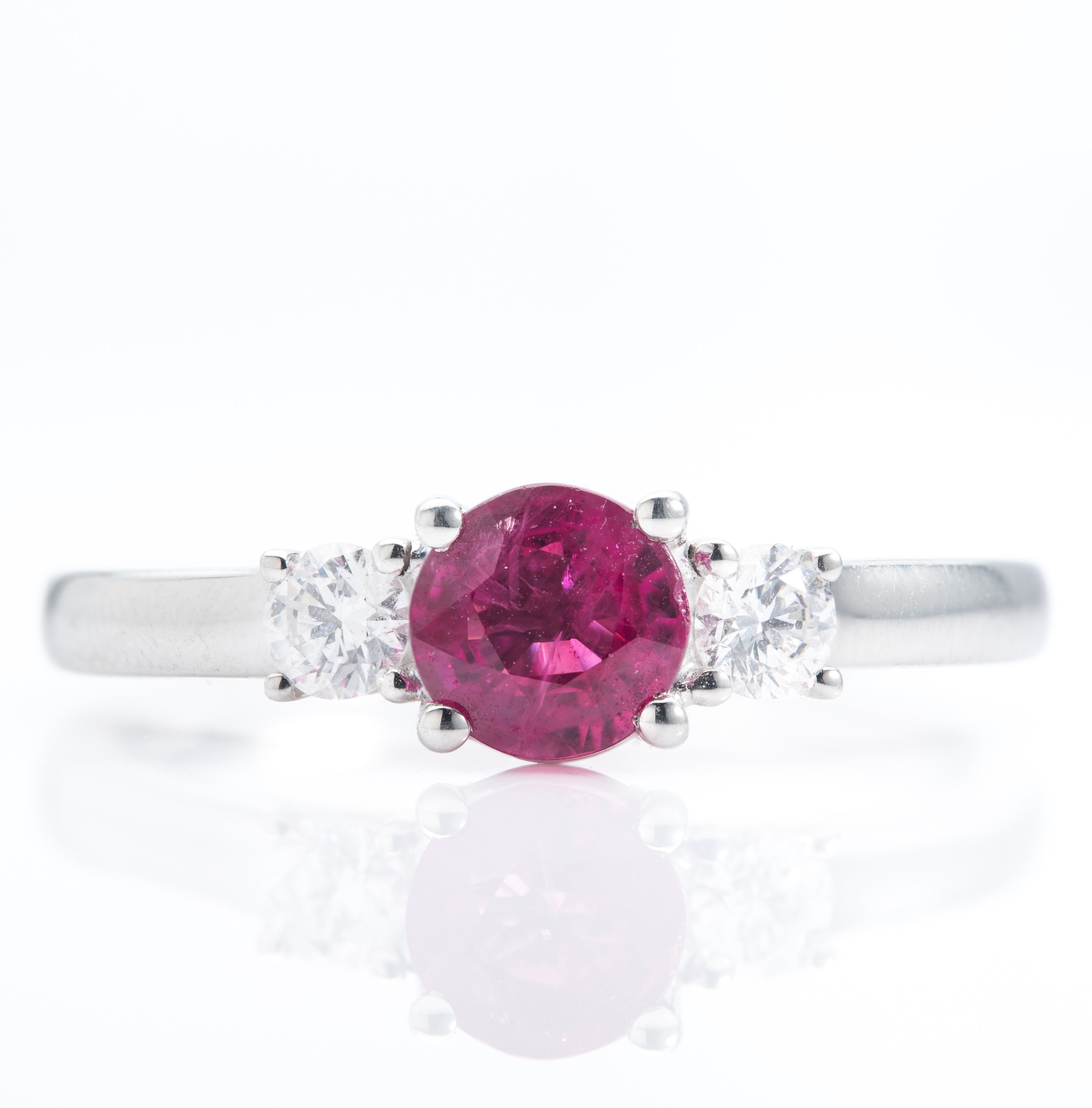 Platinum Round Cut Ruby and Brilliant Cut Diamond Trilogy Ring