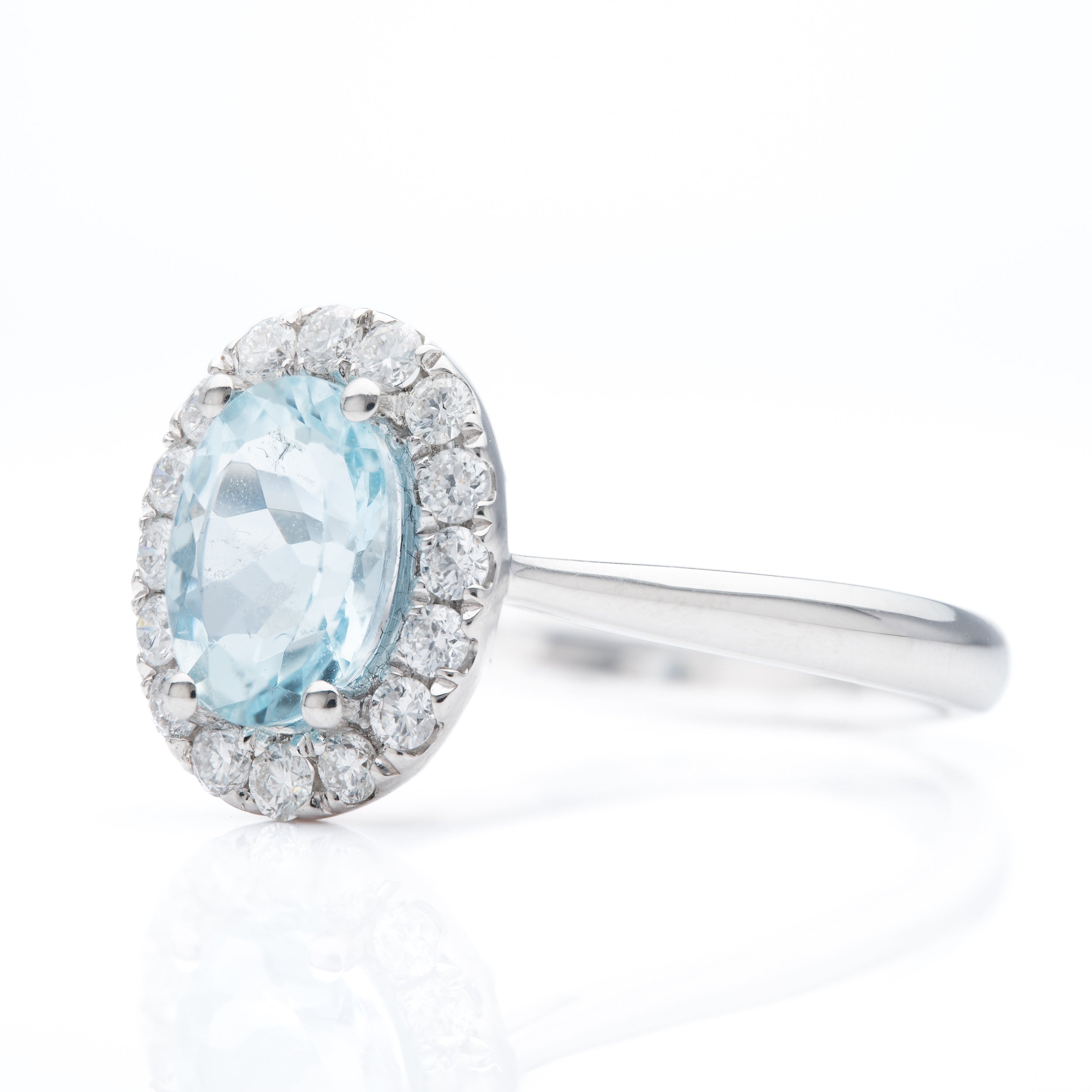 Platinum Oval Cut Aquamarine and Brilliant Cut Diamond Cluster Ring