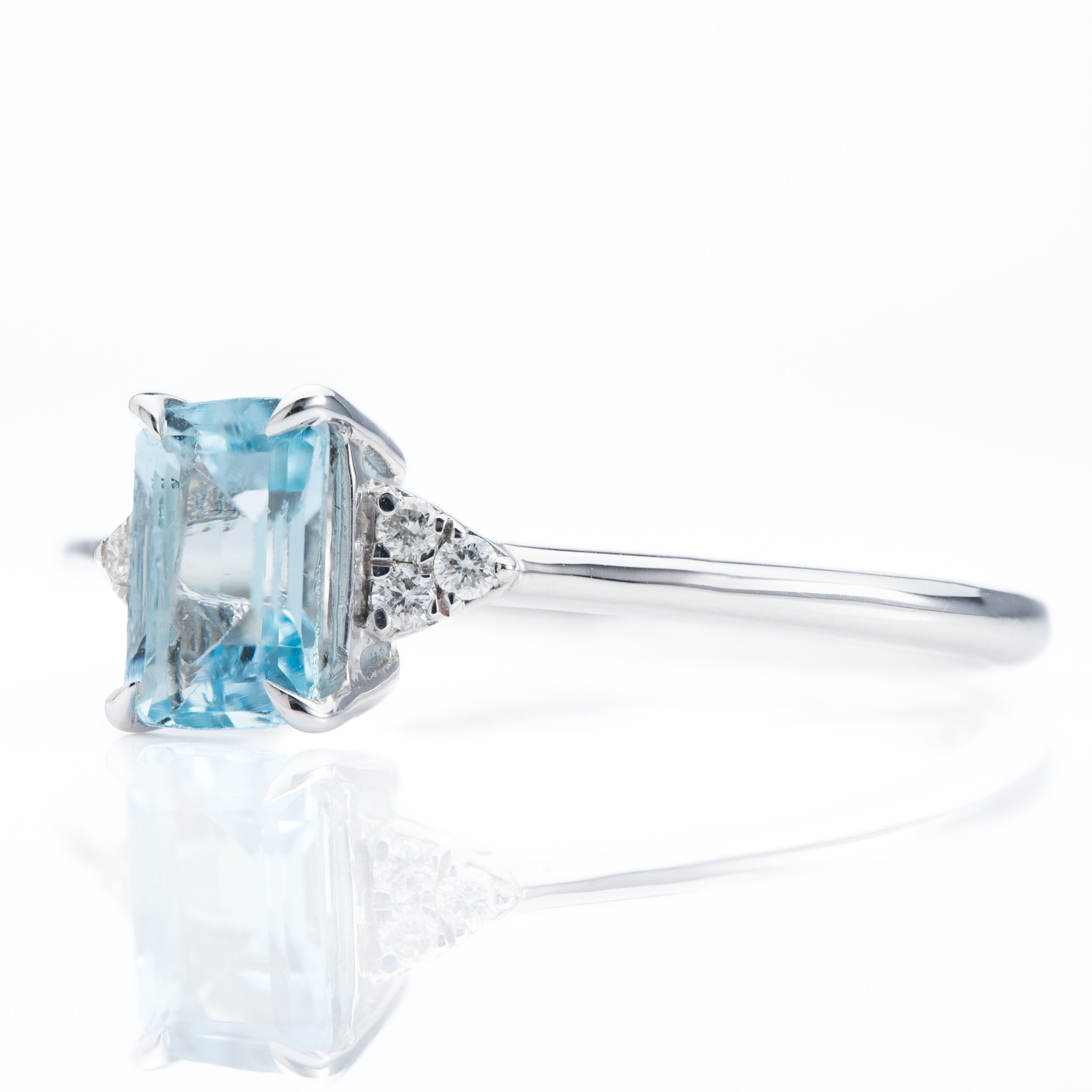 9ct White Gold Emerald cut Aquamarine and Diamond Trefoil shoulder Ring