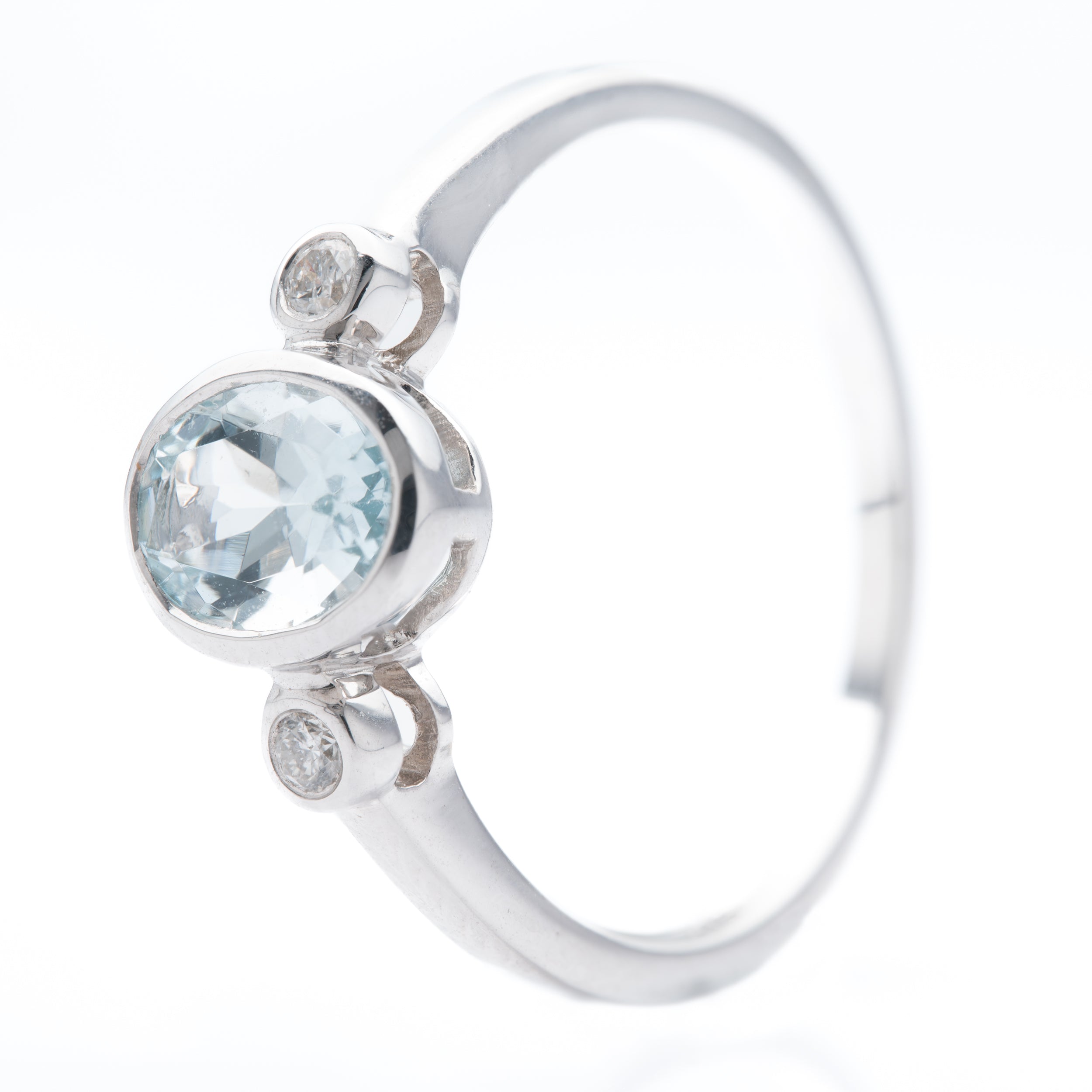 9ct White Gold Oval Cut Aquamarine & Round Brilliant Cut Diamond Rubover Set Trilogy Ring