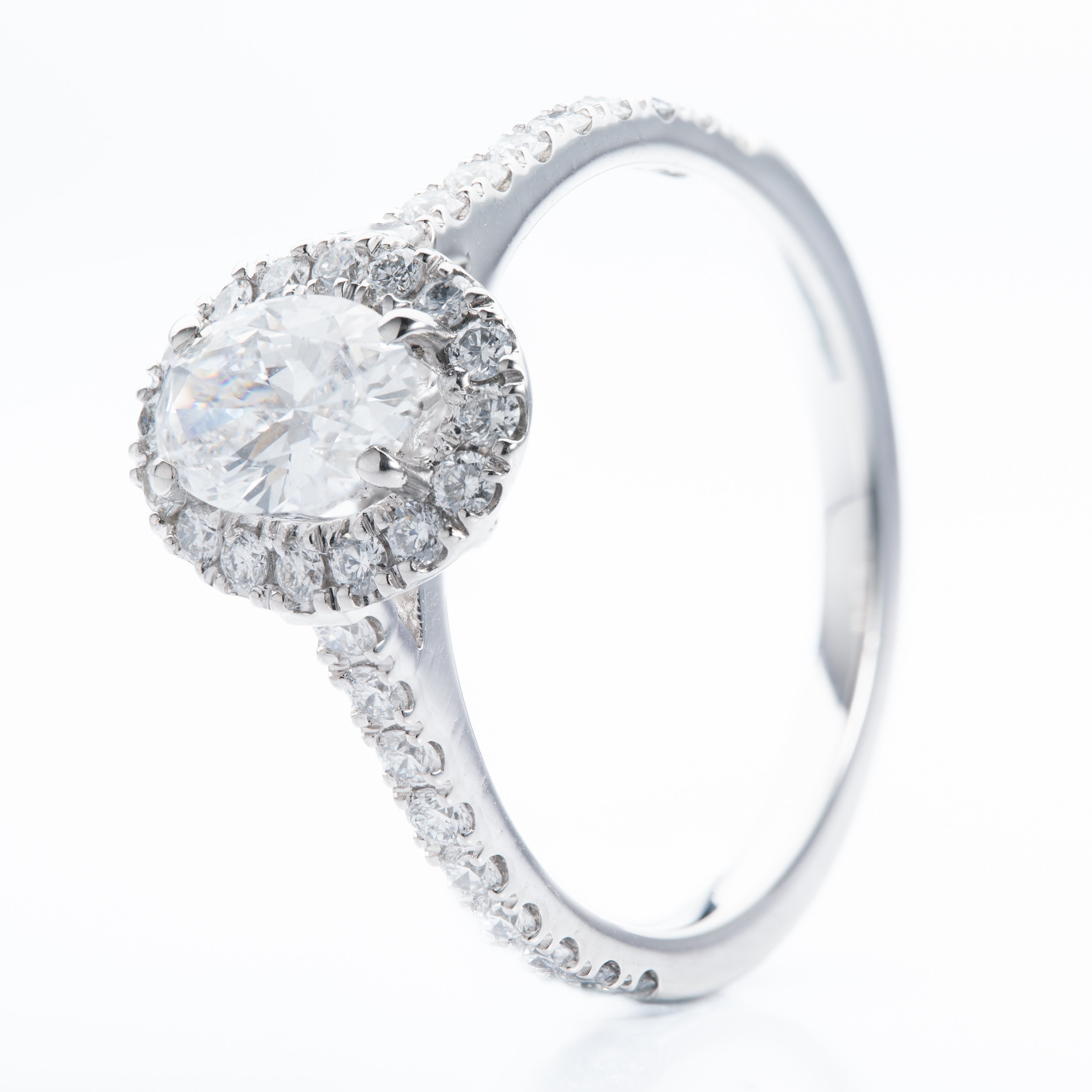 Platinum Oval and Brilliant Cut Diamond Halo Cluster Ring
