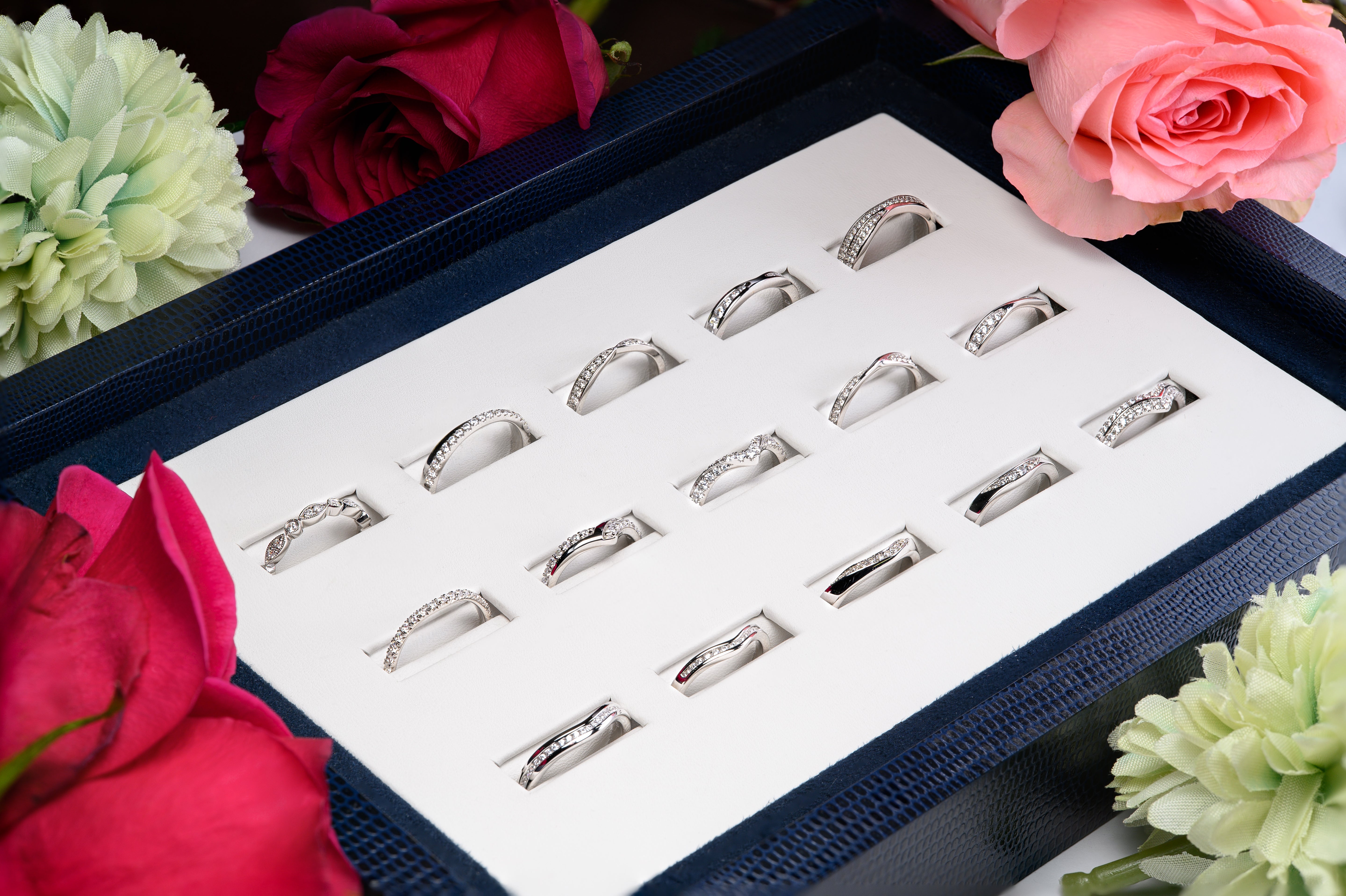 A set of sample wedding bands in a display box